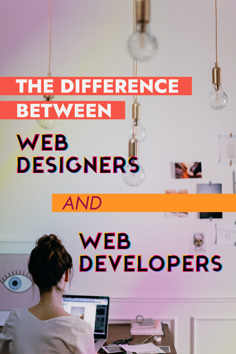 A woman with her hair in a messy bun sits at a desk looking at a laptop. There are images and photos pinned to the wall in front of her. Blurred lightbulbs hang from the ceiling. Text on the image reads The Difference Between Web Designers and Web Developers
