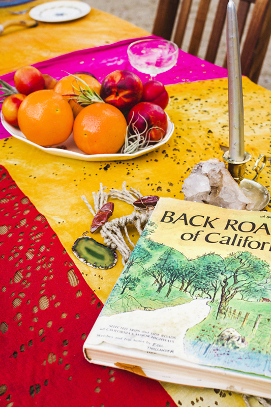 Mojave Macrame piece under a Back Roads of California book and a bowl of citrus